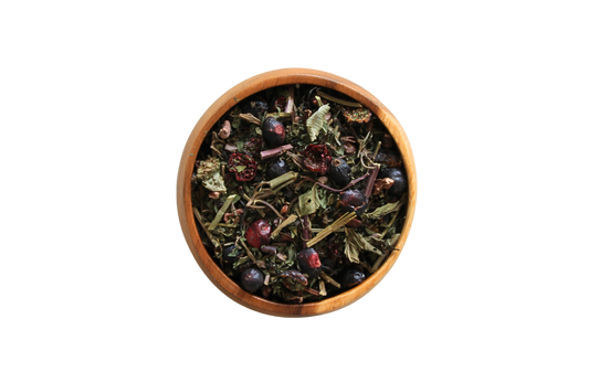 Amor loose tea leaves in a wooden bowl.