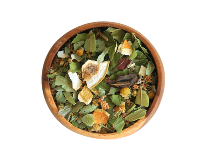 Lullaby herbal tea blend in a wooden blend.