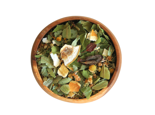 Lullaby herbal tea blend in a wooden blend.