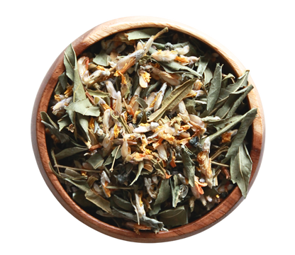 A wooden bowl of Cleanse tea herbal blend
