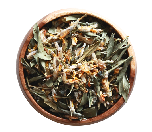 A wooden bowl of Cleanse tea herbal blend