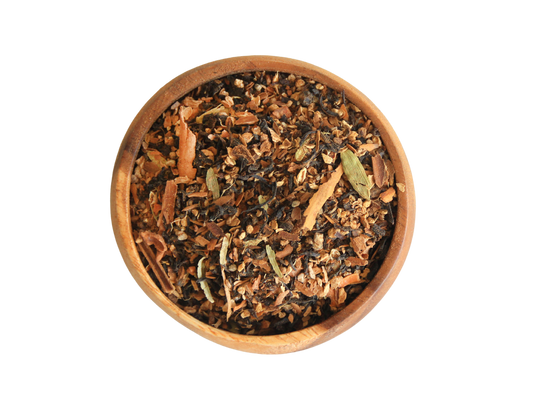 Wooden bowl filled with a mix of dried herbs and spices on no background